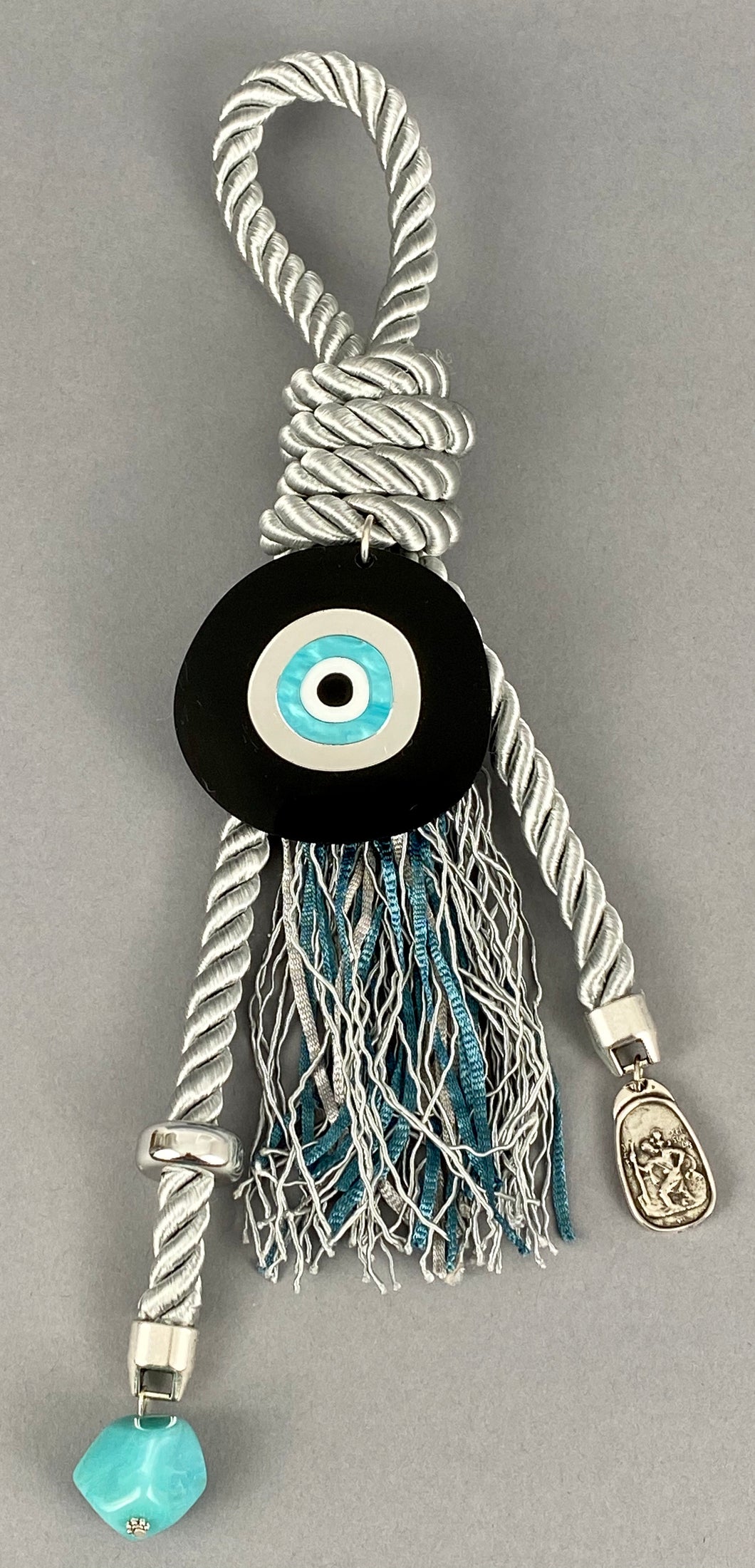 Gouri 1013 Pearl Light Grey Gouri, Large round Mati, Glass Bead, metal double sided Panagia with Ag. Christoforos and colourful tassel. Measures 13” in length