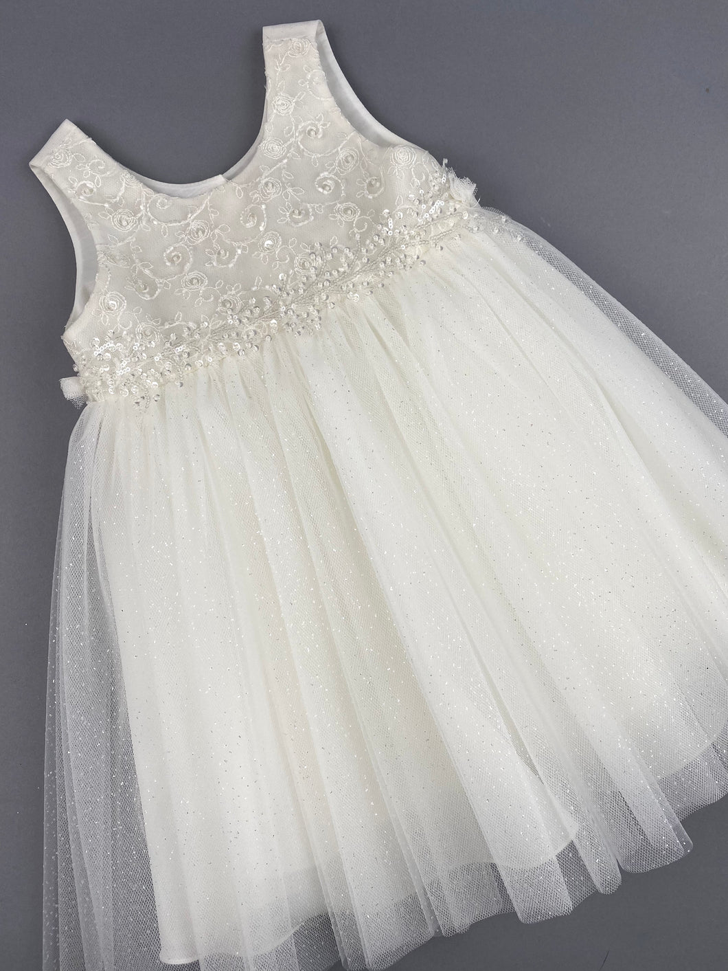 Dress 85 Girls Baptismal Christening Sleeveless Dress with new Silver Glitter, French lace across the chest, accented with Pearl flowers, matching Bolero and Hat. Made in Greece exclusively for Rosies Collections. 202585